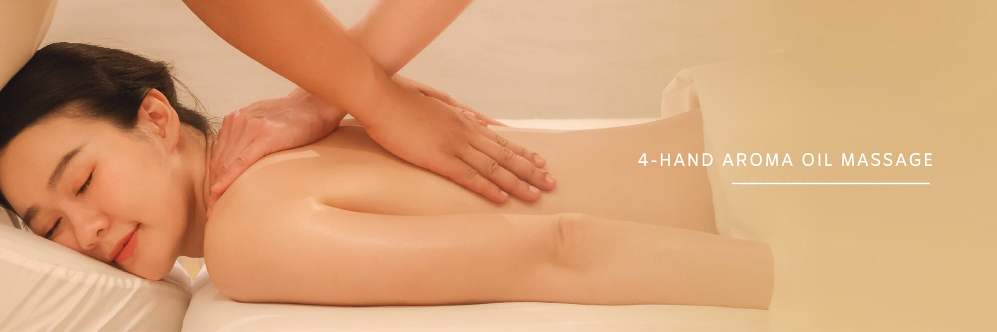 Relaxing woman receiving a massage at Makkha Spa in Chiang Mai, offering best spa experiences in Chiang Mai with aroma oil massage.
