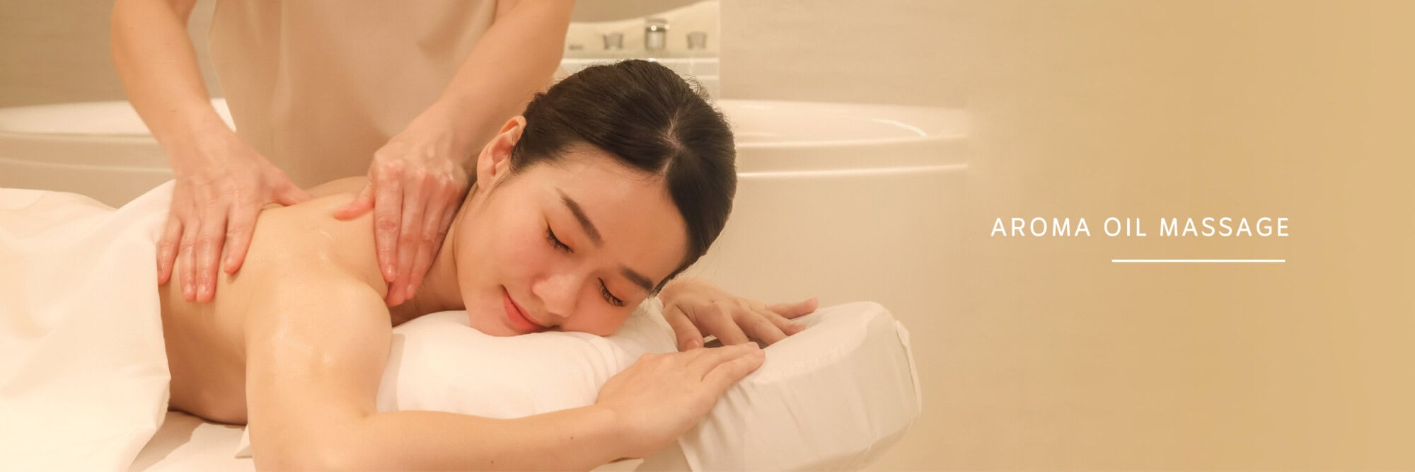 Relaxing woman receiving aromatherapy oil massage at Makkha Spa in Chiang Mai, Thailand.