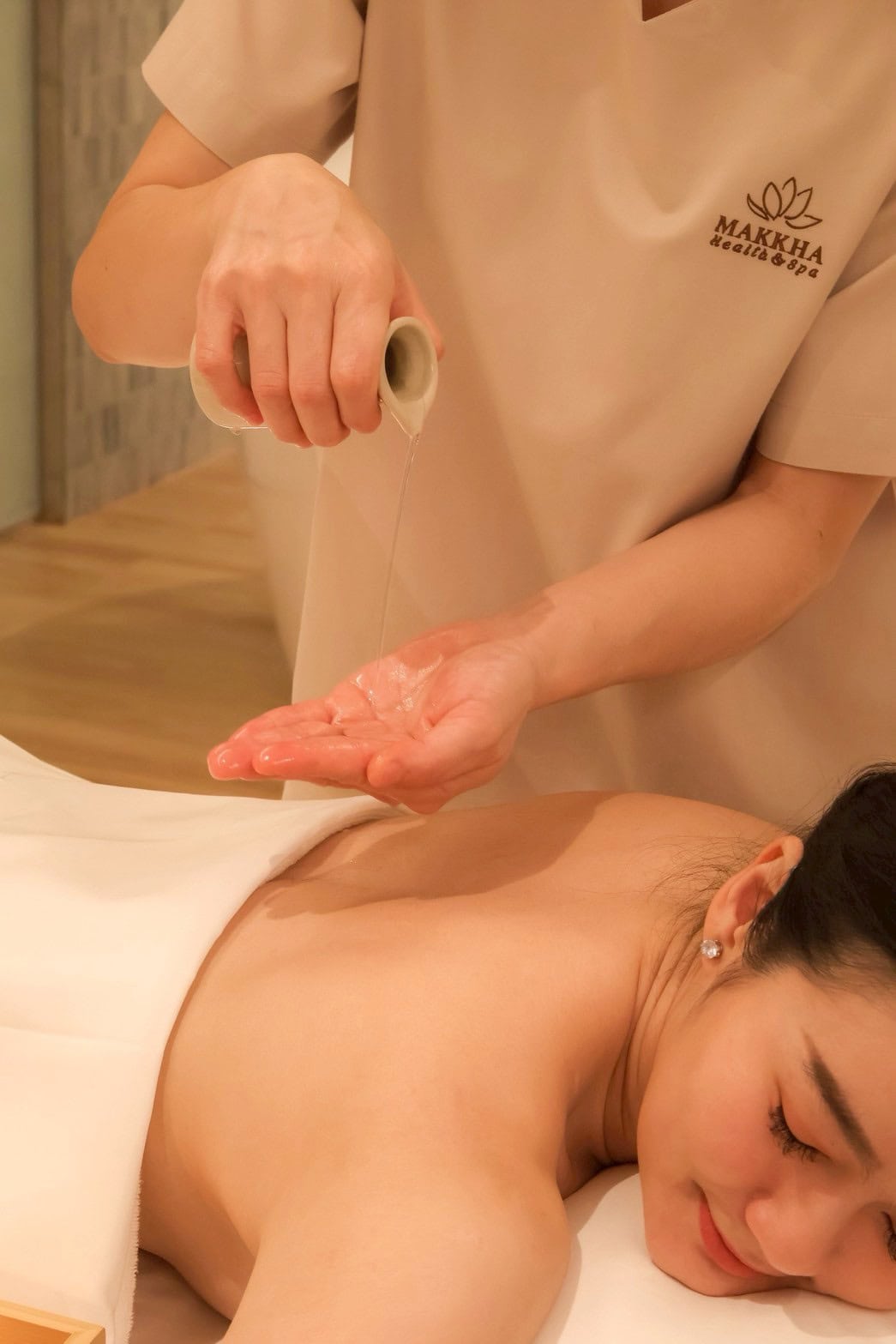 Soothing Thai massage therapy at Makkha Spa in Chiang Mai with professional masseuse.