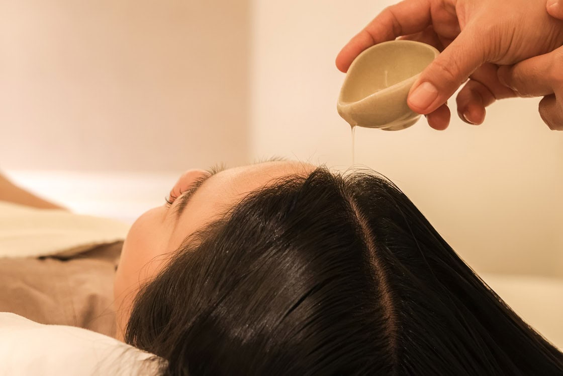 Luxurious scalp oil massage at Makkha Spa Chiangmai, offering the best spa experience in Chiangmai for relaxation and rejuvenation.