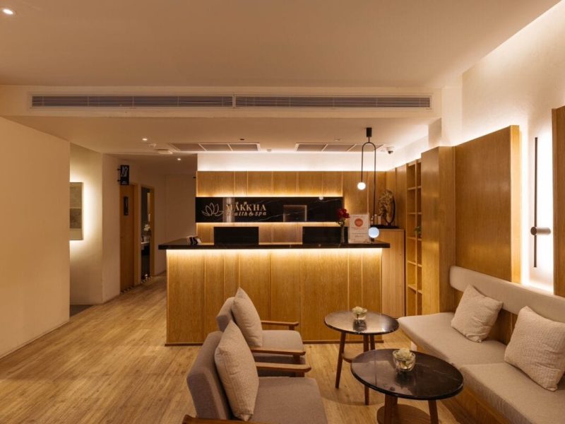 Soothing Chiangmai spa reception area with warm lighting and modern wooden decor.