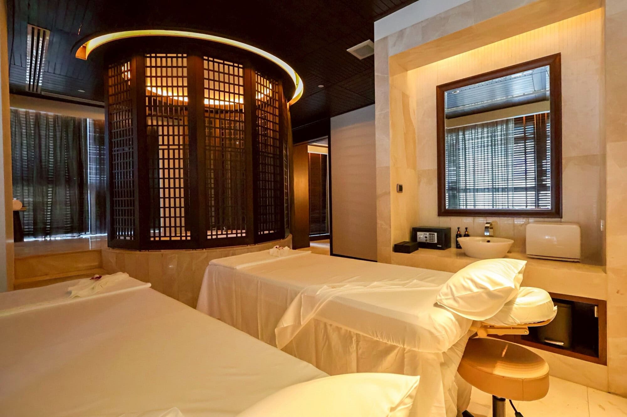 Luxurious spa treatment room at Makkha Spa in Chiang Mai featuring therapeutic massage beds, elegant decor, and a relaxing ambiance designed for ultimate relaxation and wellness.