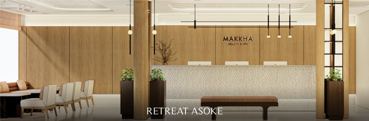 Relaxing spa reception area at Makkha Spa in Chiangmai with modern wooden decor and comfortable seating, offering a tranquil retreat experience.